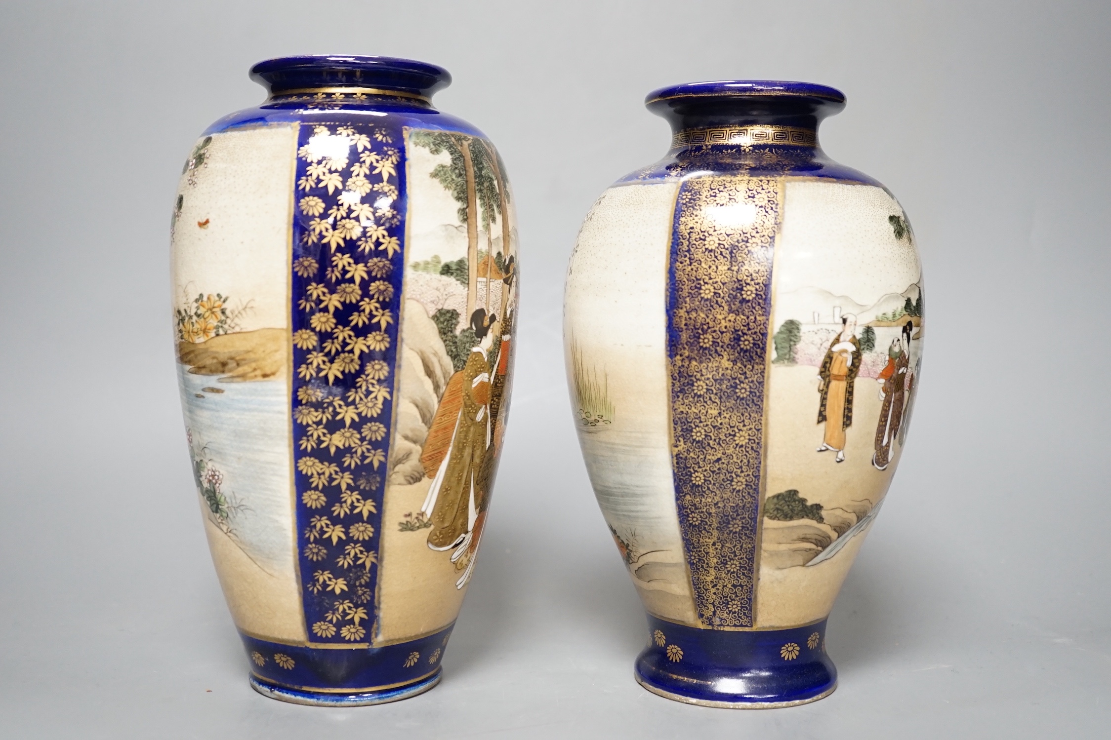 A pair of Japanese Satsuma pottery vases, one signed Kinkozan - 25cm high